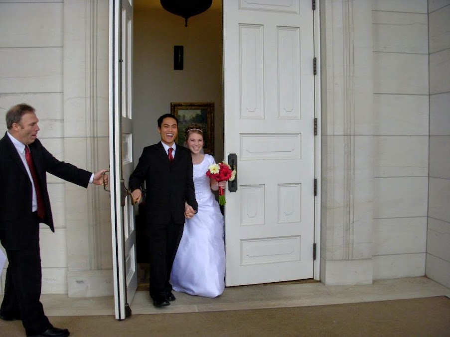 My husband and I coming out of the temple on our wedding day