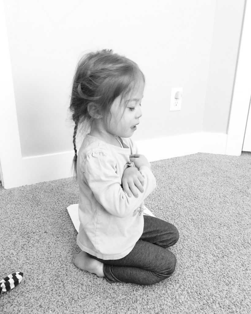 Child saying a prayer